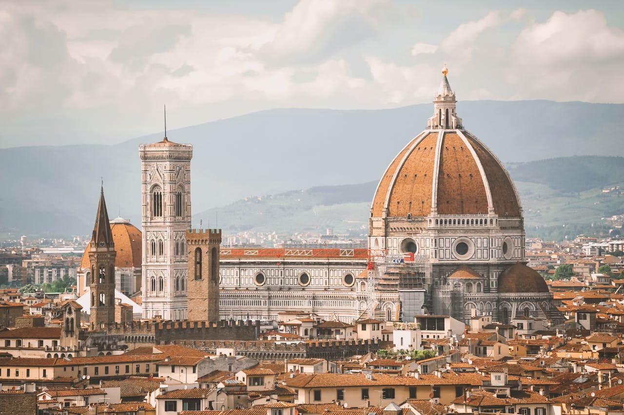 A breathtaking view of Florence Cathedral, also known as Il Duomo, with the cityscape at dawn.